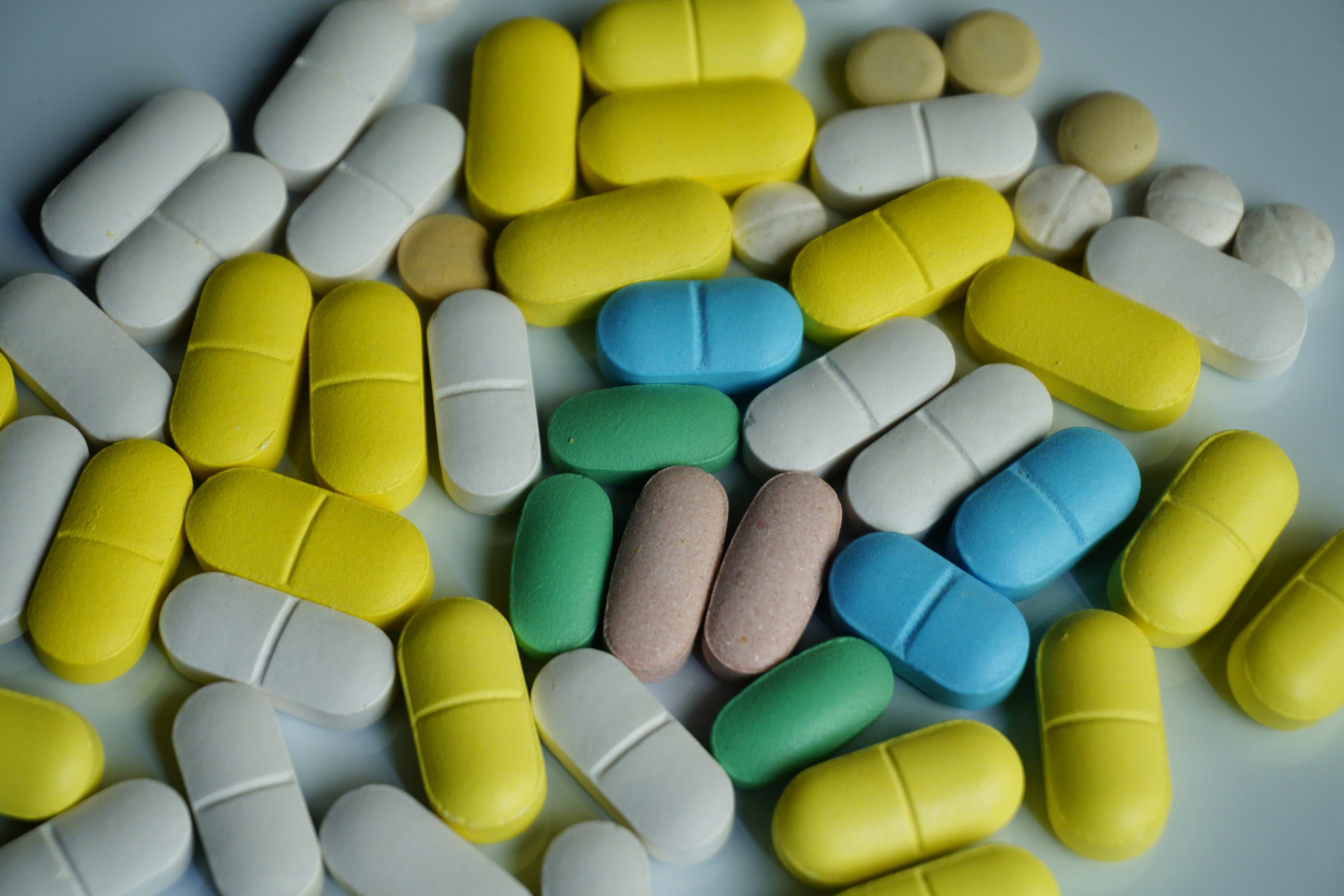 Different colours of medicines packed together